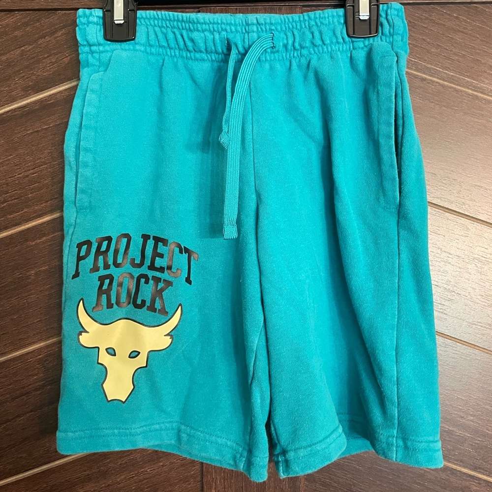 Under Armour Project Rock Youth Medium shorts in teal